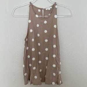 Tans and white tank top